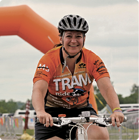 Woman biking wearing biker's jersey