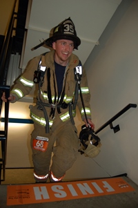 Firefighter at finish line, Climb to the Top Boston 2016