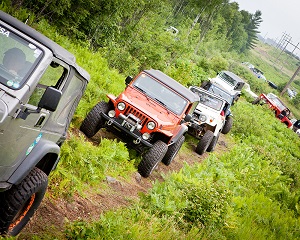 trucks driving up a mountain